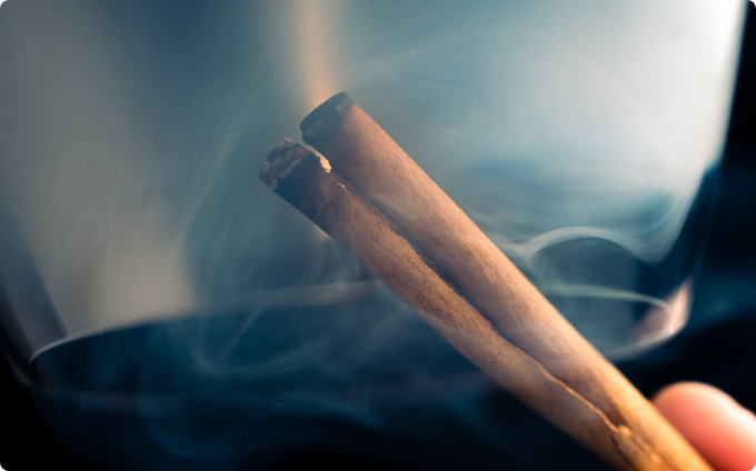 Cinnamon smoking a glass